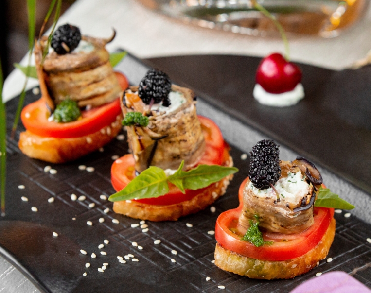 crackers-with-tomato-slices-eggplant-rolls-berries